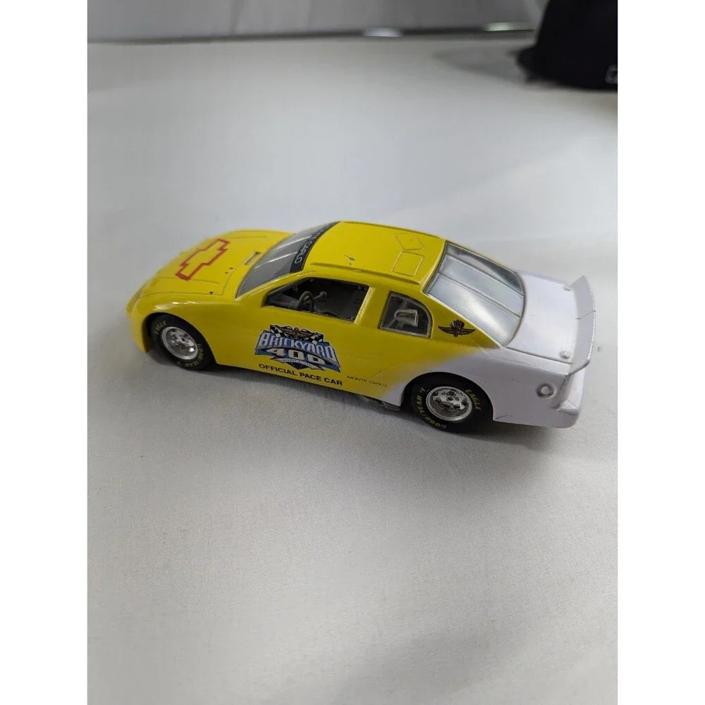 1996 Racing Champions Chevrolet BriCkyard 400 1:64 Monte Carlo Car Yellow